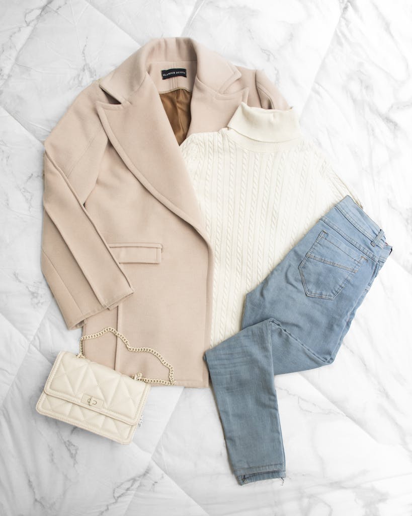 Set of Clothes on White Fabric